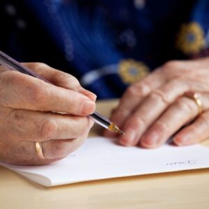 person writing letter