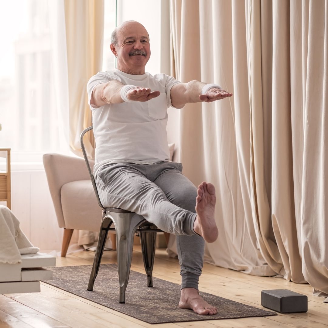 senior doing chair exercise