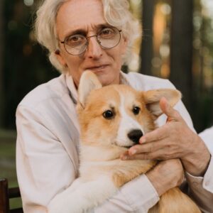 senior man holding a dog