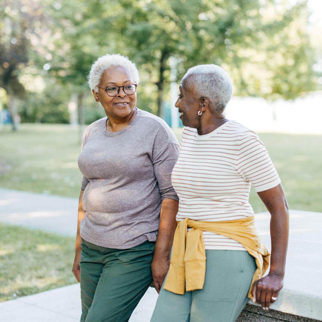 2 woman friends talking outside
