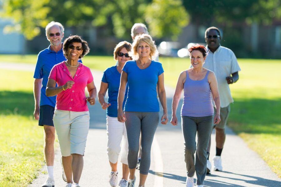seniors walking on road for active retirement living in a 55+ community in Elkhorn