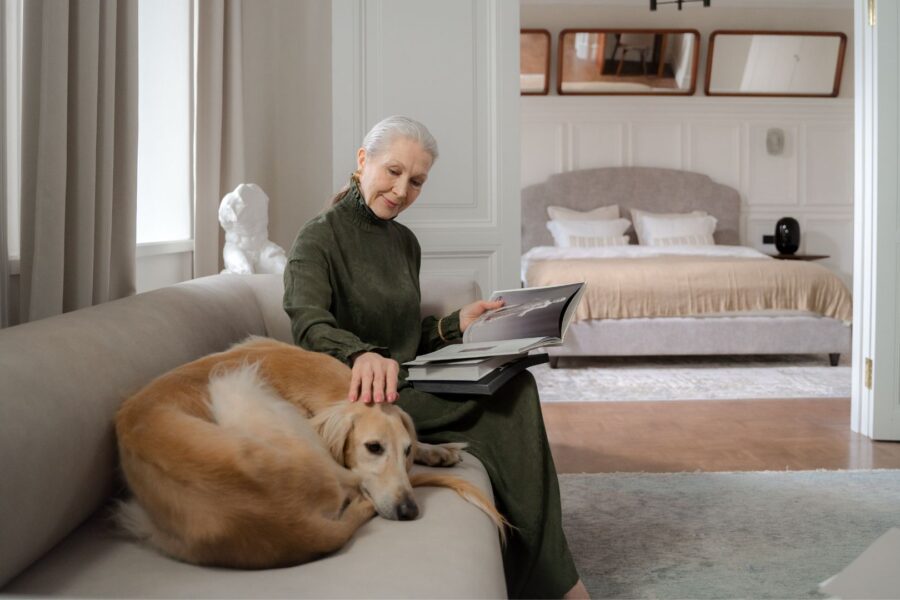 woman with her dog on a couch