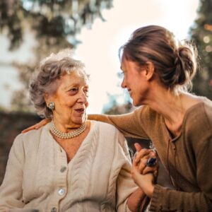 elderly woman with care giver