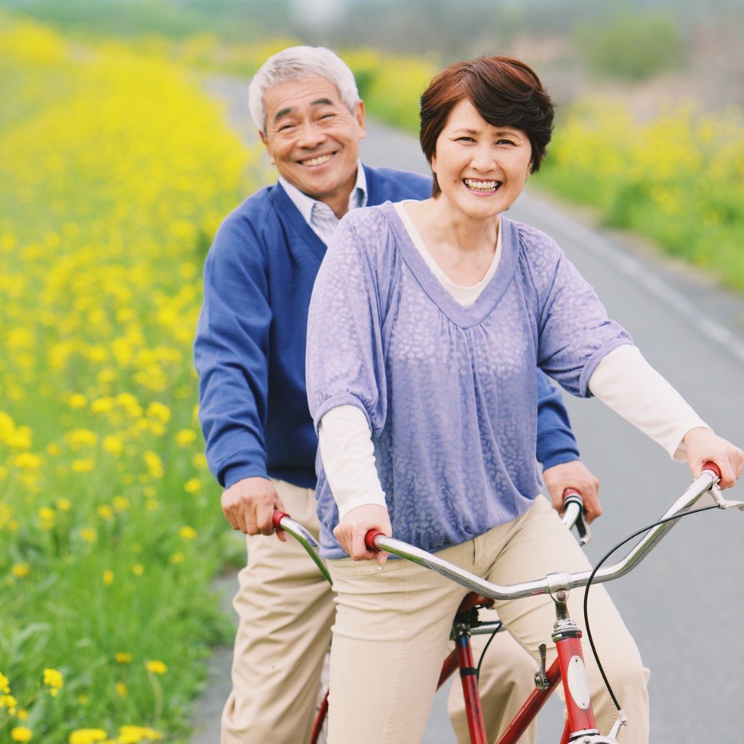 senior couple riding bike
