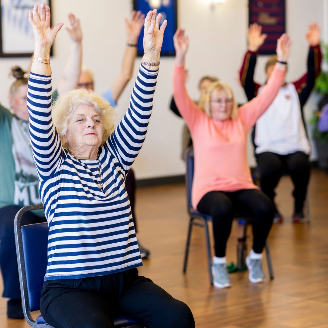 seniors in a chair fitness class