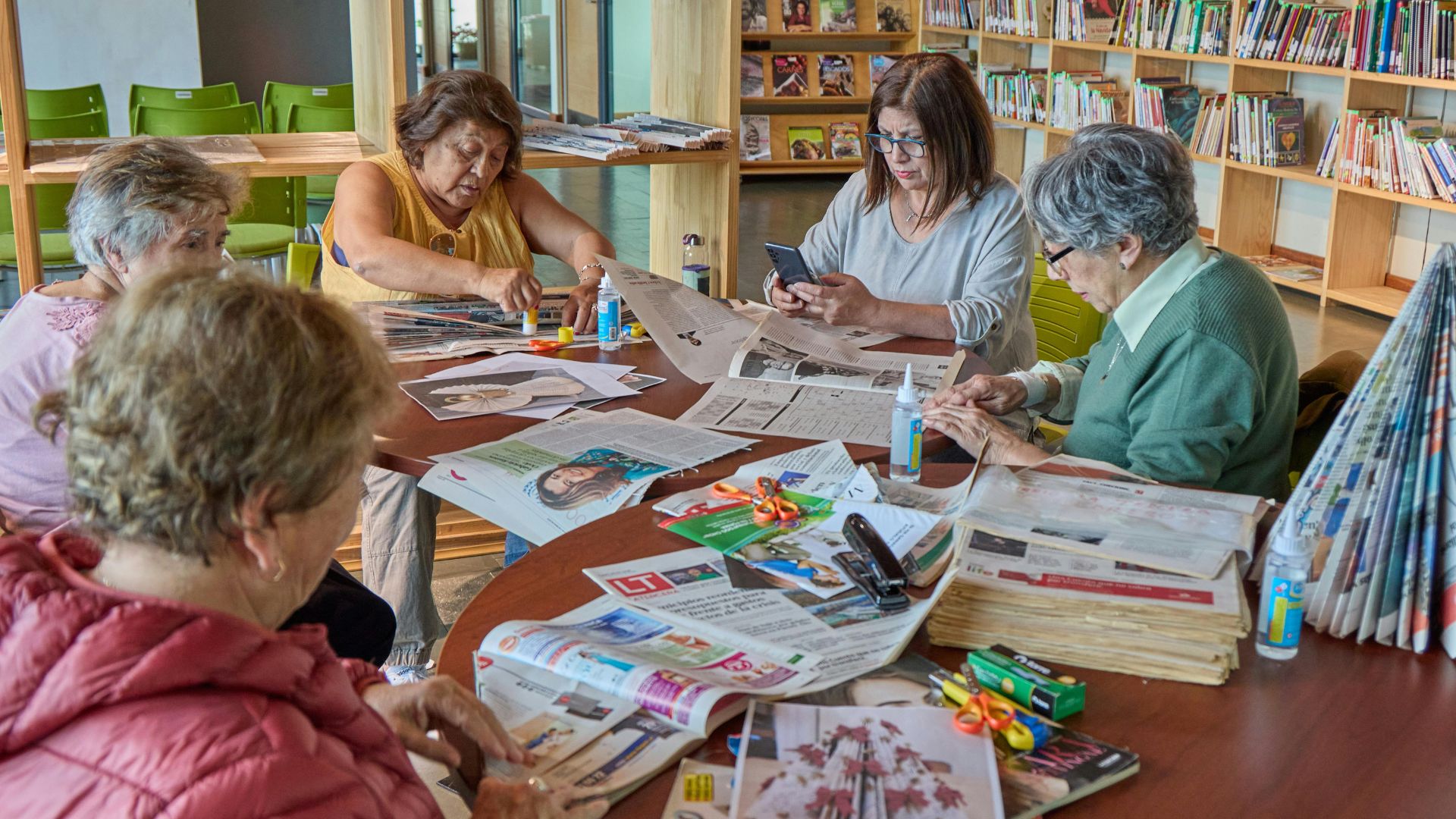 Seniors doing a photo collage together